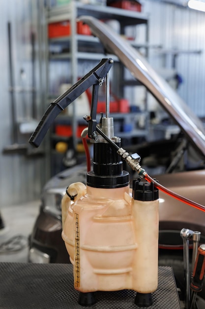 Engine oil change in car service Car brake oil pump
