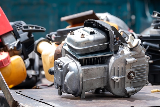 The engine of the old lawn mower is a household item the small engine while being modified to repair the internal parts to be able to use normally