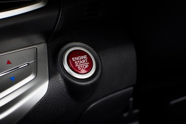 Engine start / stop button of luxury car, automotive part
concept.