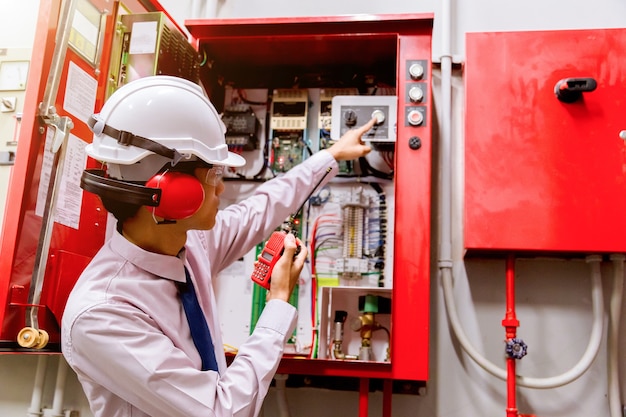 Engineer checking Industrial fire control system, Fire Alarm controller.