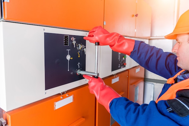 The engineer checks the absence of induced voltage on the high voltage cells