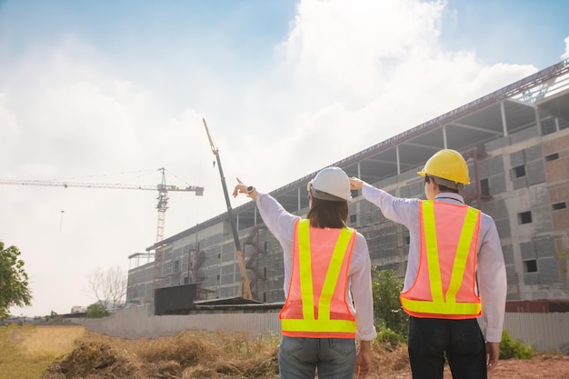 Engineer Construction concept, Asian engineer construction teamwork standing  on site construction