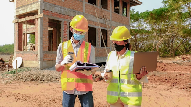 engineer contractor team meeting work plan industry project and check design at construction site