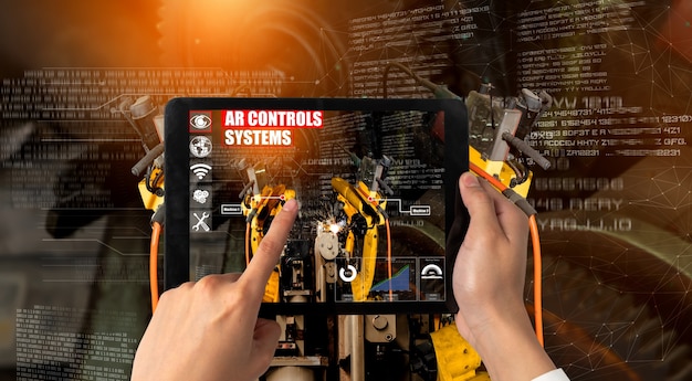 Engineer controls robotic arms by augmented reality industry technology