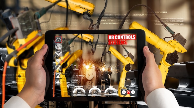 Engineer controls robotic arms by augmented reality industry technology