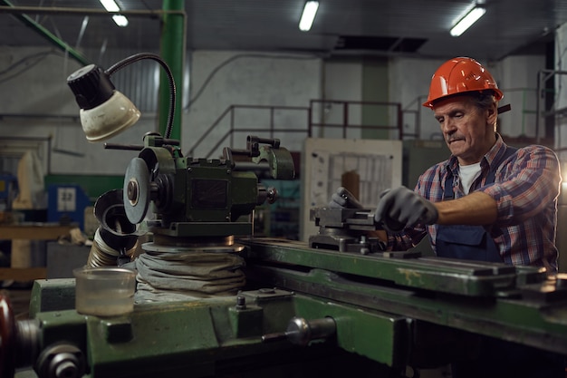 Photo engineer cutting metal details