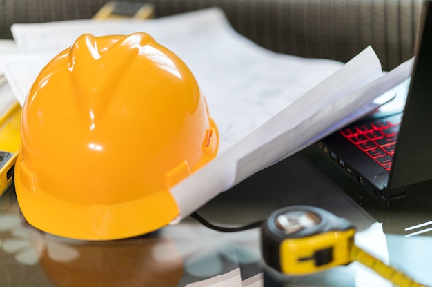 Engineer desk background ,Close-up of Architect engineer drawing plan on blueprint with architect equipment