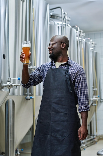 Engineer drinking fresh beer in