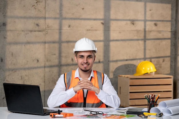 Engineer handsome young smart guy civil worker in helmet and vest very excited of work