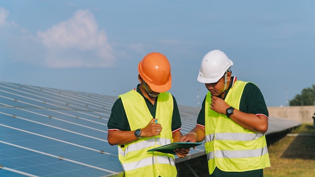 Photo engineer inspect solar panel  at solar power plant