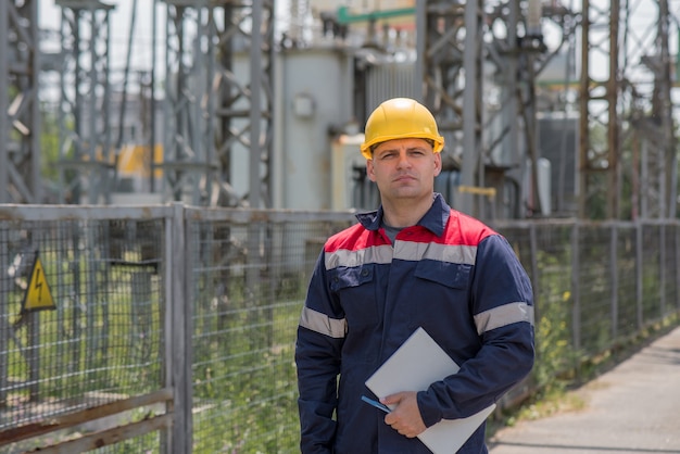 Engineer inspecting the equipment of the substation