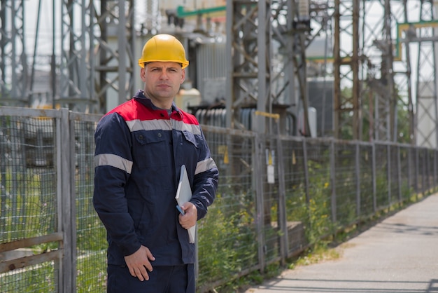 Engineer inspecting the equipment of the substation