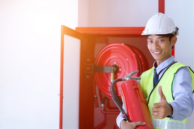 Engineer inspection Fire extinguisher and fire hose.