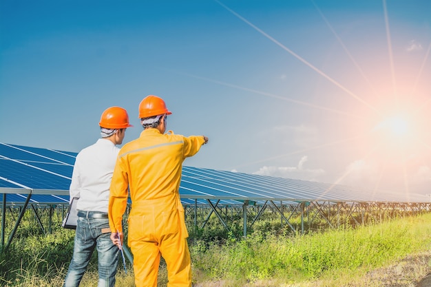 The engineer is checking the solar panel system