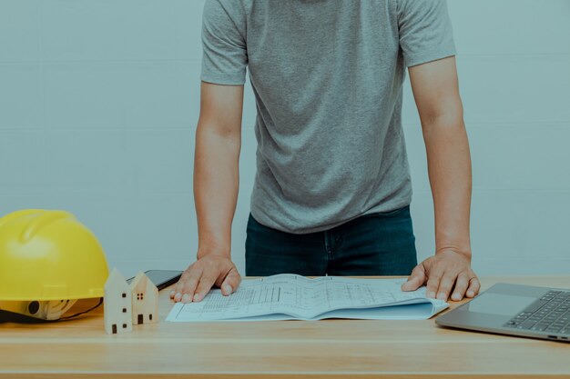 An engineer looking at a residential construction plan