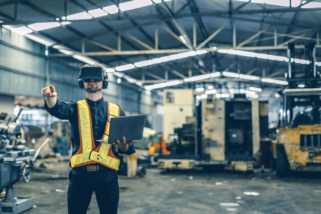 Engineer male using VR virtual reality technology in modern warehouse factory new innovation engineering