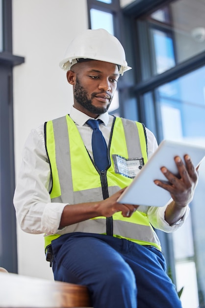 Engineer manager tablet and black man working on construction strategy plan maintenance inspection and building online report African man architect contractor and site planner on digital tech