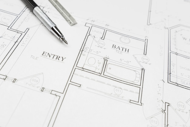 Engineer Pencil and Ruler Resting on Custom House Plans