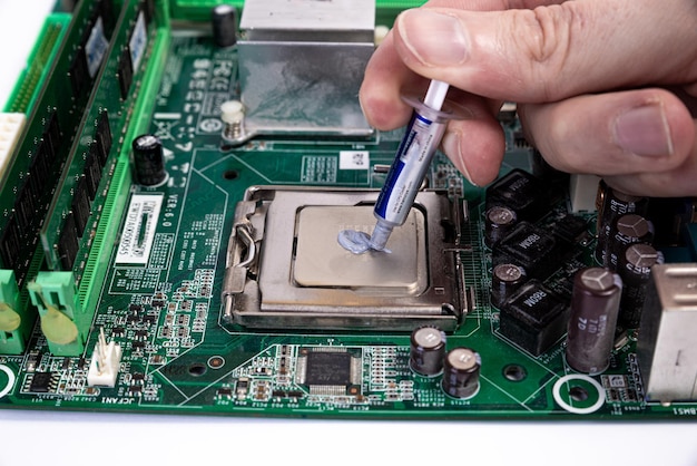 Engineer repairman holding hands in black gloves chip processor CPU to insert into the socket of the computer motherboard The concept of technology hardware in the neon light