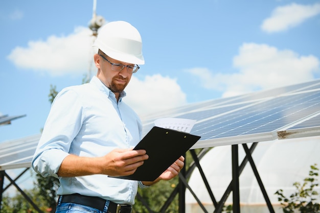 Engineer at solar power station with solar panel Practical lessons on renewable energy power plants