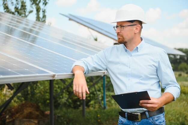 Engineer at solar power station with solar panel Practical lessons on renewable energy power plants