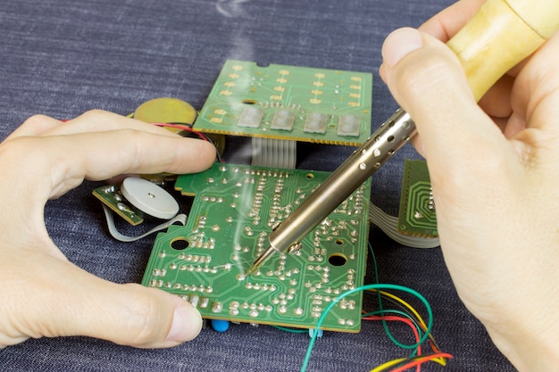 Engineer soldering electronic components