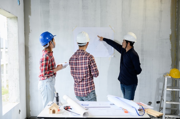 Engineer team discuss and working at construction property site. Inspection at village project and estate building.