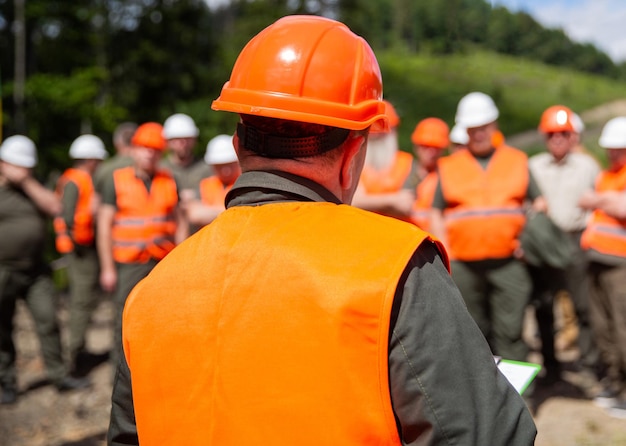 Engineer team in hardhat for work Worker group wearing vest safety Building concept