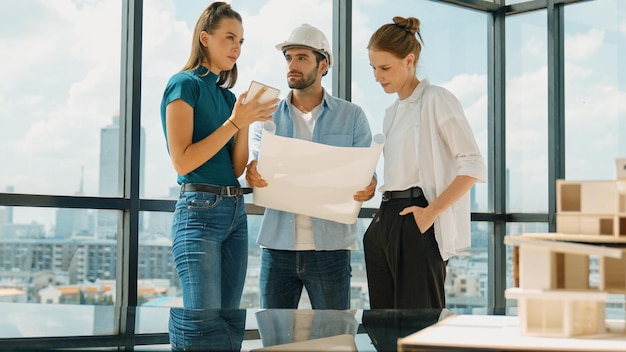 Photo engineer team talk about design while manager hold at project plan tracery