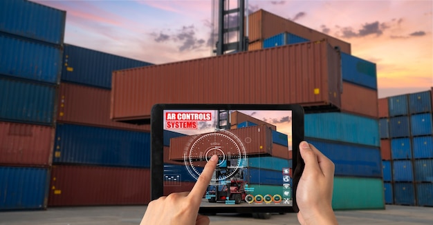 Engineer use augmented reality software in cargo container yard