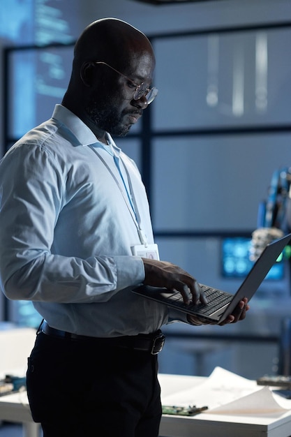 Engineer using laptop at his work