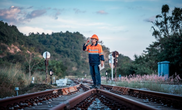 Engineer worker wearing safety uniform control operating and check controlled Lathe grinding machine