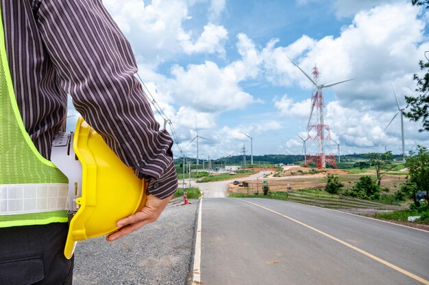 Engineer worker at wind turbine power station construction site