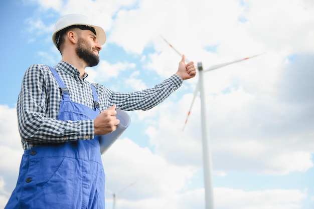 Engineer working at alternative renewable wind energy farm Sustainable energy industry concept