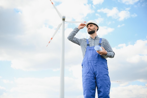 Engineer working at alternative renewable wind energy farm Sustainable energy industry concept