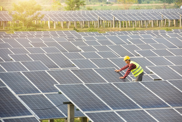 Engineer working on checking equipment in solar power plant