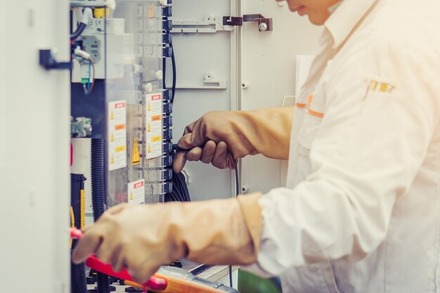 an engineer working on checking and maintenance equipment in solar power plant