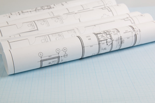 Engineering house drawings and blueprints on graph paper