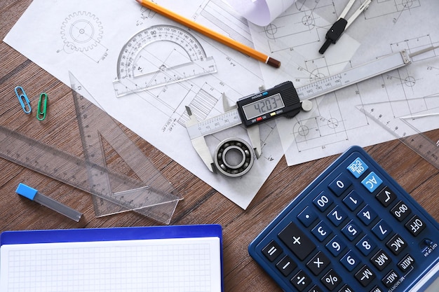 Engineering supplies on wooden table top view