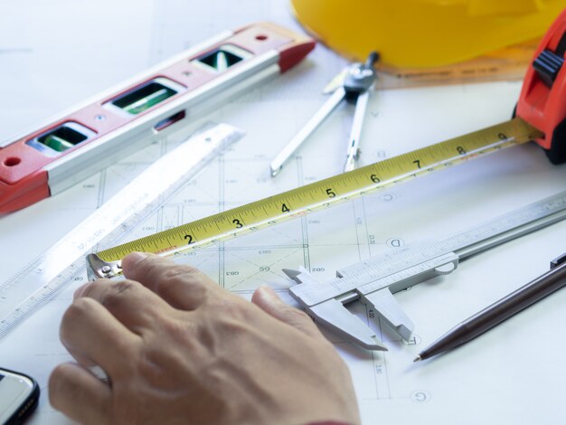 Engineering use equipment to make construction blueprint drawing