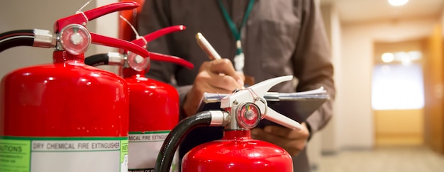 Photo engineers are checking fire extinguishers.