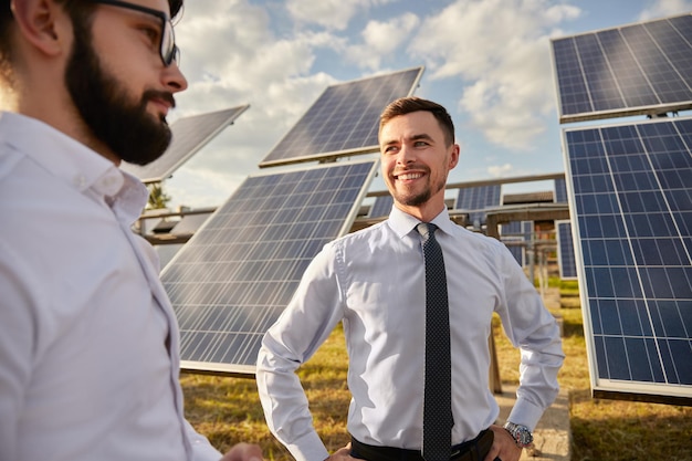 Engineers in field with solar panels