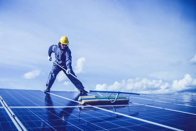 engineers operating and check generating power of solar power plant on solar rooftop