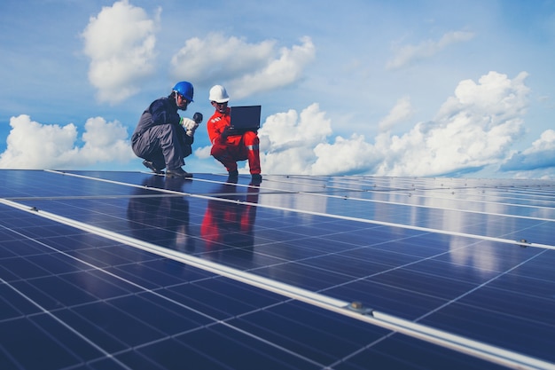 engineers operating and check generating power of solar power plant on solar rooftop