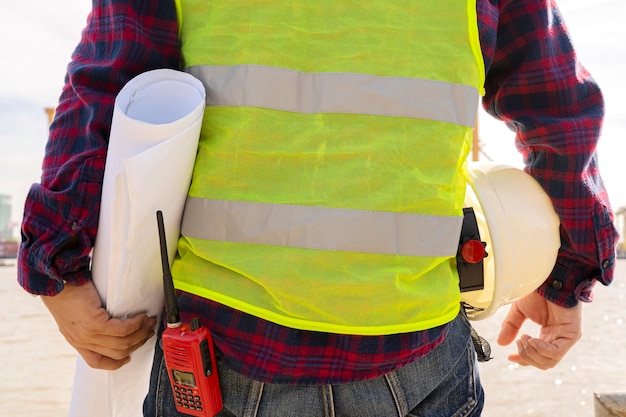 Engineers and workers inspect projects on construction site\
background radio communication site