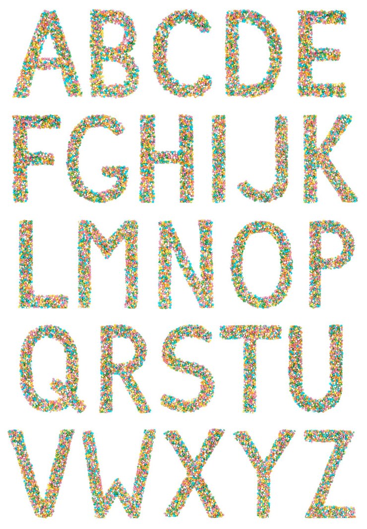 Photo 英語のアルファベット文字と記号は、白い背景で隔離の小さなキャンディーで作られました。