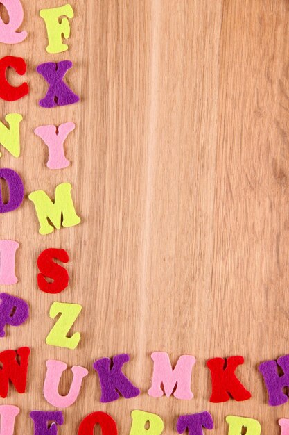 English alphabet on wooden background