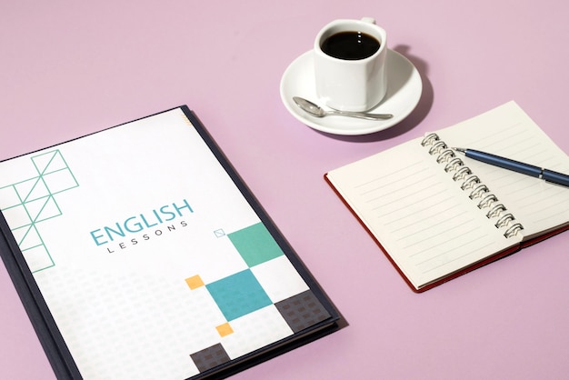 english book resting on the table of working space