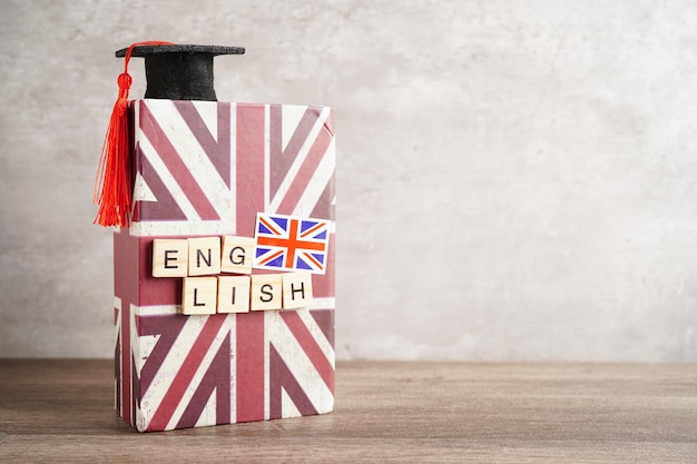 English book with graduate hat learning and tutorial for foreigner