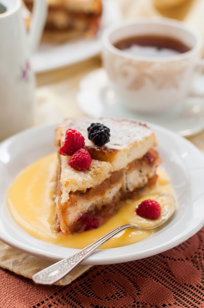 English bread and butter pudding with apples and cranberries